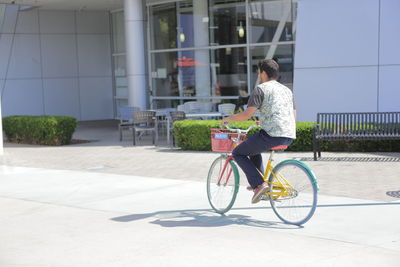 Side view of man riding bicycle