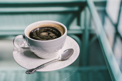 Close-up of black coffee on table