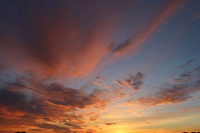 Low angle view of dramatic sky during sunset