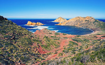 Scenic view of sea against clear blue sky