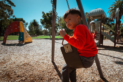 Side view of man working at playground