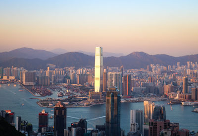 Modern buildings in city at sunset