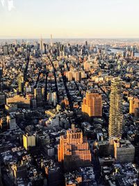 Cityscape against sky during sunset