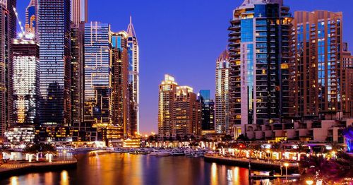 Illuminated buildings in city at night