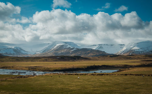 Scenic view of snowcapped mountains against sky