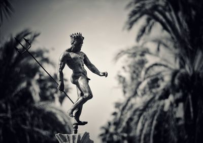 Low angle view of statue against sky