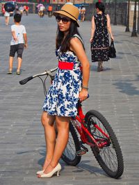 Full length of woman on street in city