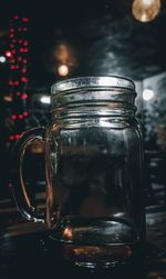 Close-up of glass jar on table