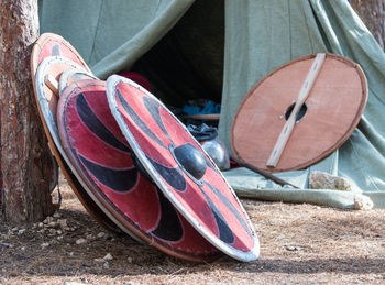 Close-up of weapons on field