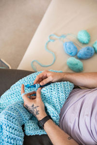 Cropped hand of woman holding paper currency