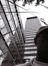 Low angle view of man on modern building
