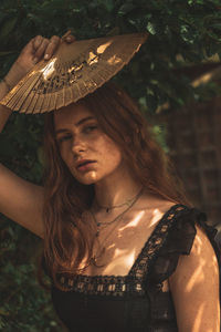 Portrait of young woman in hat