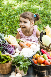 Portrait of girl with vegetables in basket