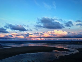 Scenic view of sea against sky at sunset