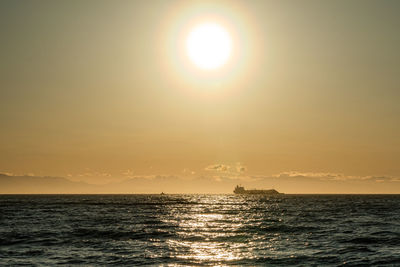 Cargo ship at sunset