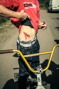 Man riding bicycle on road