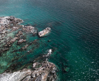 High angle view of rock formation in sea