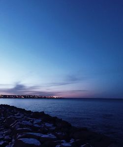 Scenic view of sea against clear blue sky