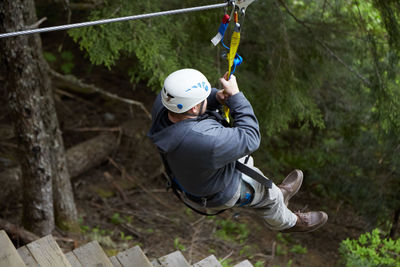 Full length of man holding rope