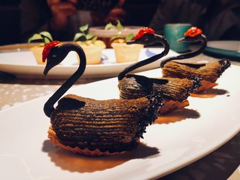 Close-up of cake served on table