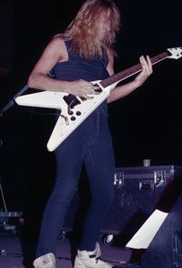 Man playing guitar at music concert