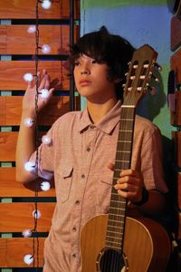 Young man holding guitar