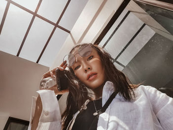 Low angle portrait of girl at home