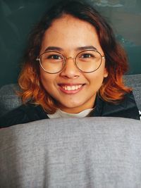 Portrait of smiling young woman at home