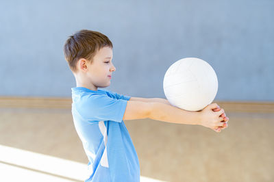 Boy playing with volleyball