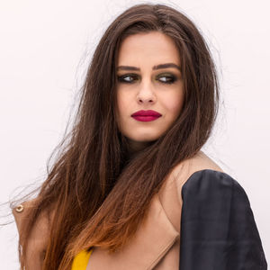 Portrait of a beautiful young woman over white background