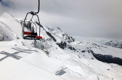 Car on snow covered mountain against sky