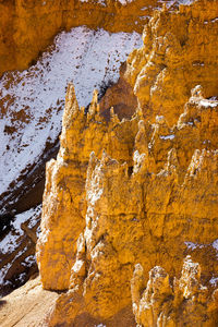 Close up telephoto zoom photo of bryce canyon national park hoodoos lit by sun.