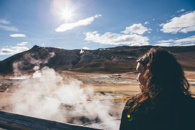 Woman on landscape against sky