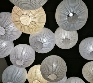 Low angle view of illuminated lanterns hanging at night