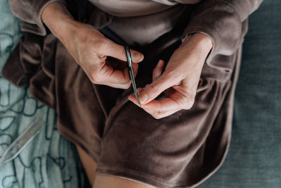 Midsection of woman holding gift