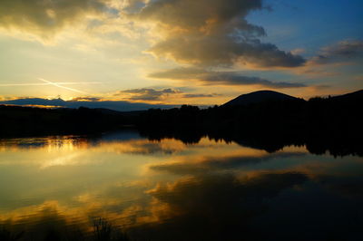 Scenic view of lake against sky during sunset