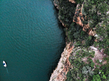 High angle view of rock formation in sea