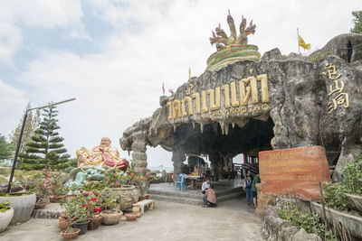 Statue of historic temple against sky