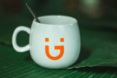 Close-up of coffee cup on table