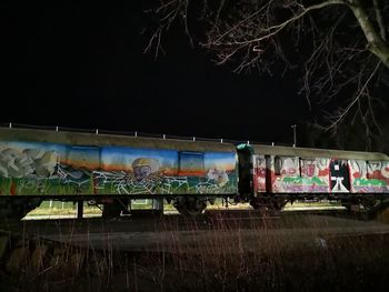 Train on railroad tracks at night