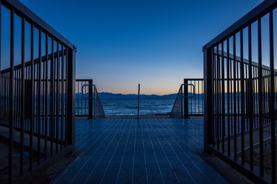 Observation point by sea against clear sky during dusk
