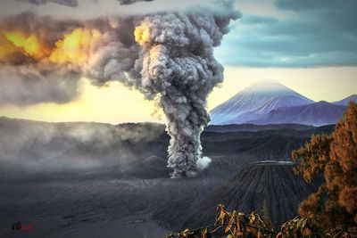 Volcano erupting in landscape