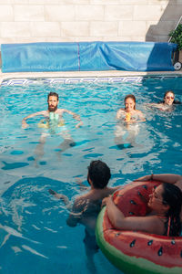 High angle view of people swimming in pool