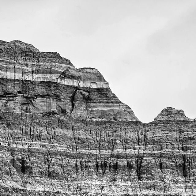 rock formation, tranquility, sky, tranquil scene, landscape, nature, mountain, geology, low angle view, rock - object, non-urban scene, arid climate, physical geography, clear sky, scenics, cliff, beauty in nature, eroded, day, desert