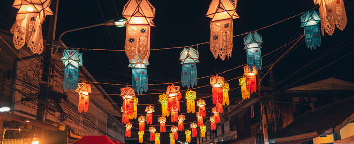 Low angle view of illuminated buildings at night