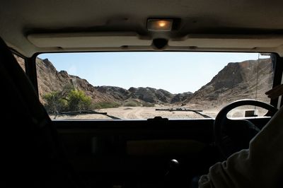 Man seen through car window