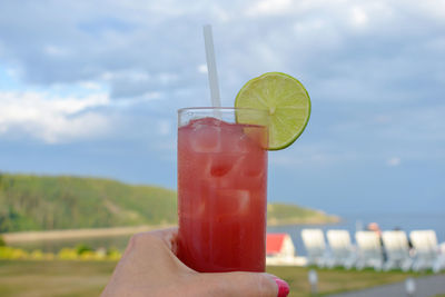 Close-up of hand holding drink