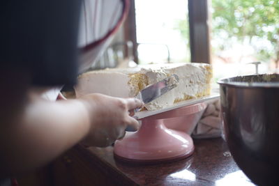 Close-up of hand holding ice cream