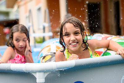 Portrait of smiling boy swimming in pool