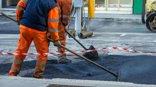 Low section of man working at construction site